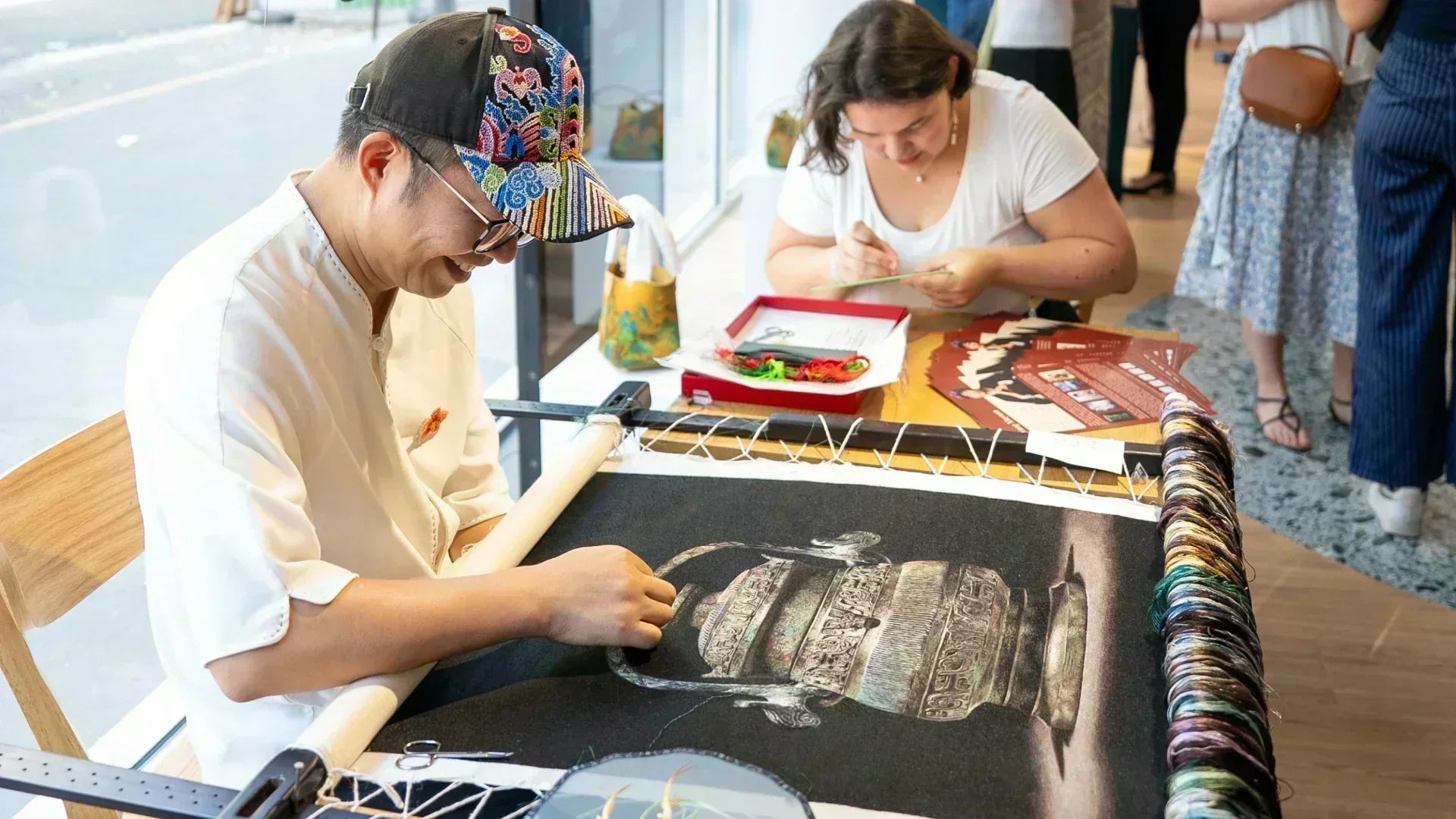 Silk Threads, Cultural Bridges: Master Wang Xinyuan Brings Cantonese Embroidery to Paris - SinoCultural
