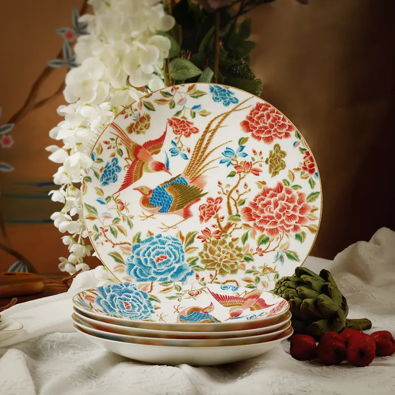 Chinoiserie round dinner plate displayed upright with stacked plates in front.