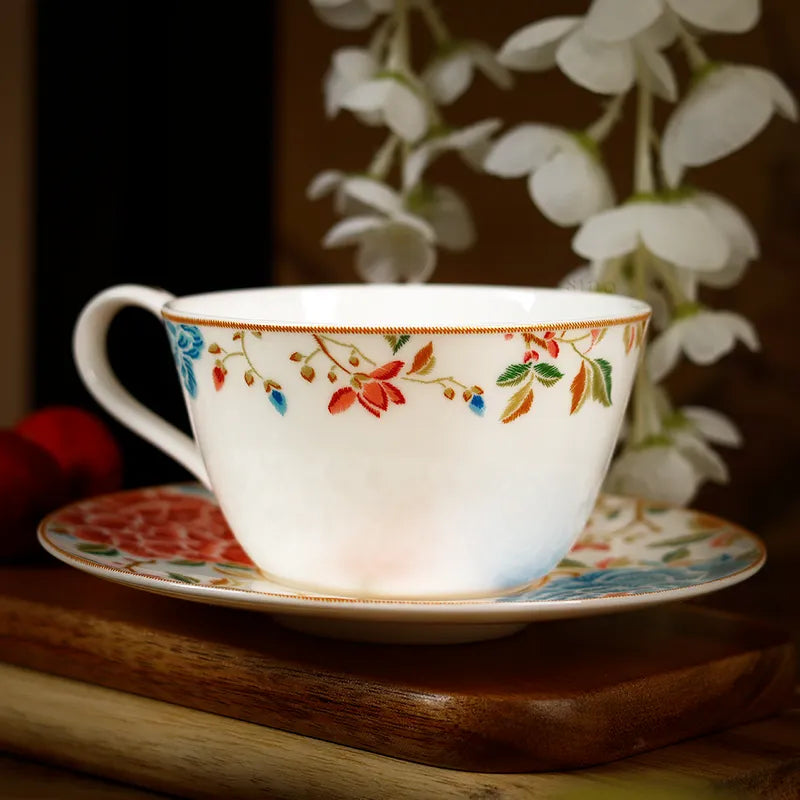 Front view of tea cup on saucer highlighting glossy finish.