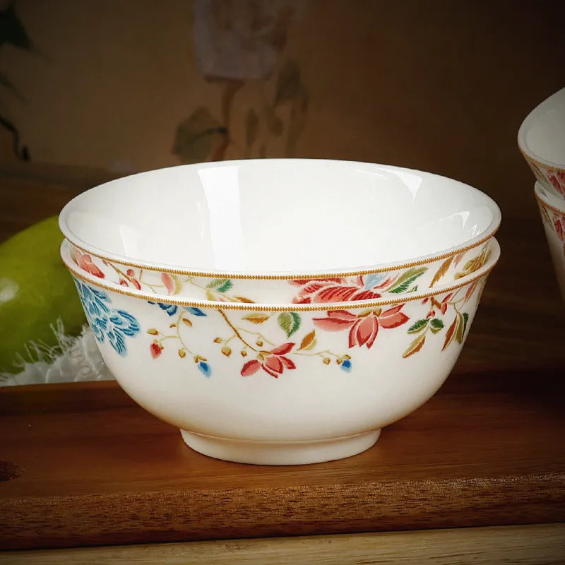 Stacked 2-piece Chinoiserie bone china round bowls on wooden shelf (angled view).