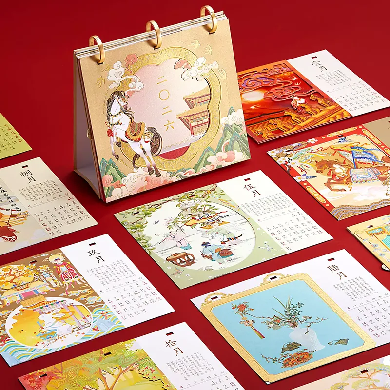 Close-up of desk calendar pages with Fire Horse motifs and daily grid layout.