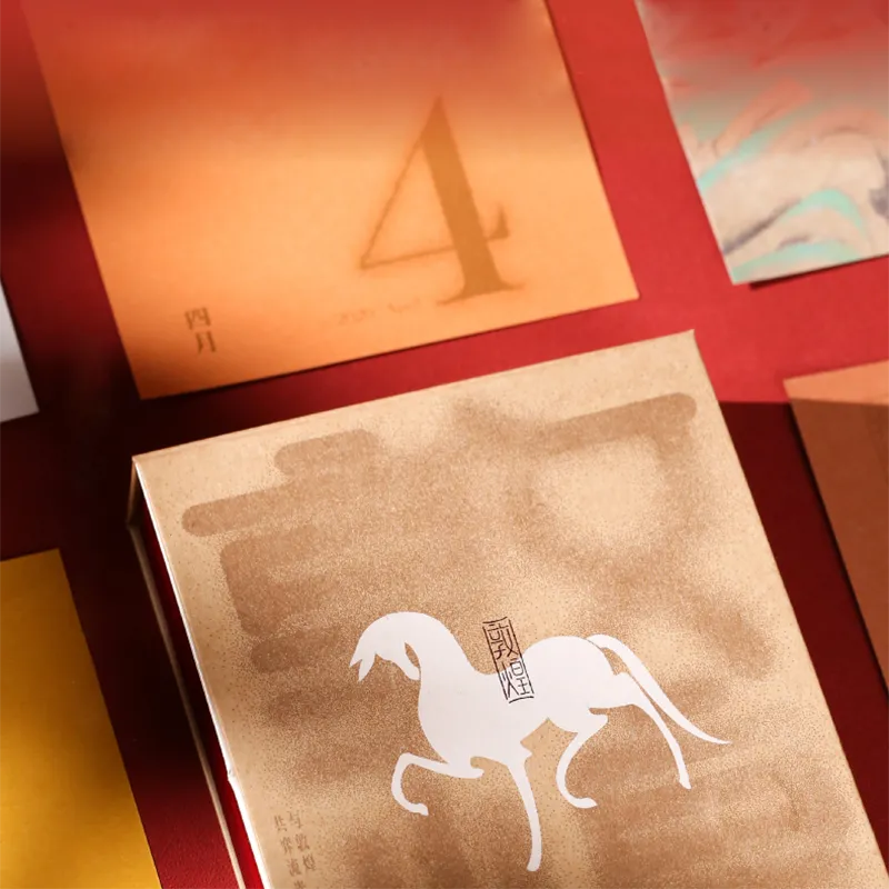 Content sample: January week spread with camel caravan illustrations.