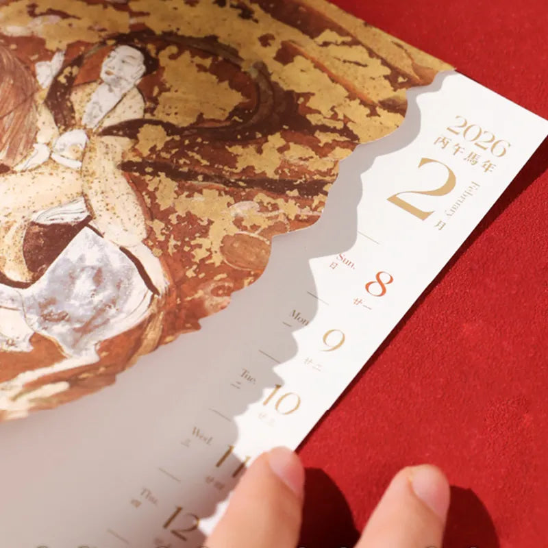 December spread: Dunhuang winter scene with horse zodiac forecast.