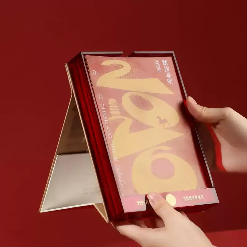 Gift packaging: Red box with Dunhuang cloud patterns and horse seal.