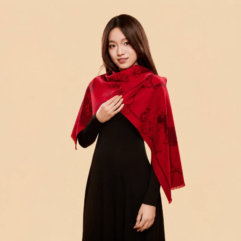 Model wearing a red cashmere-touch mulberry silk scarf draped over her shoulders, featuring traditional Chinese motifs.