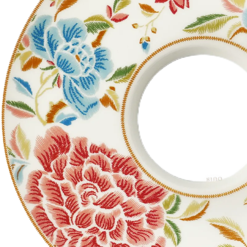Left rim floral detail of Chinoiserie bone china tea cup saucer.