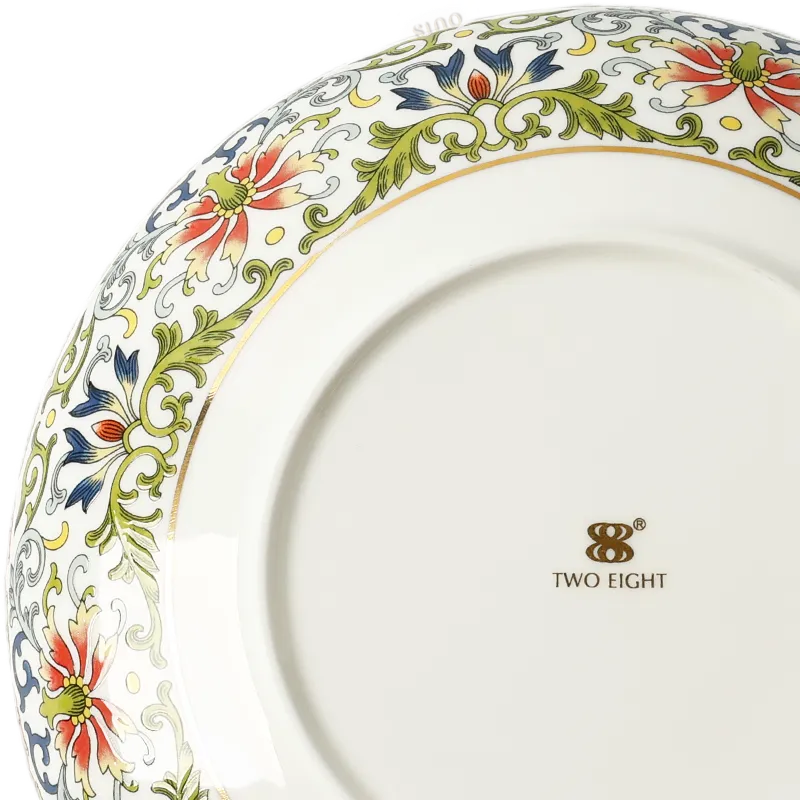 Close-up: Left corner enamel artwork on plate bottom.