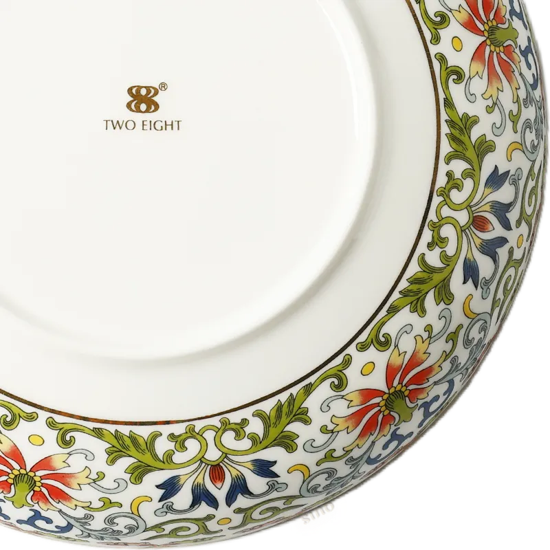 Close-up: Right corner enamel artwork on plate bottom.