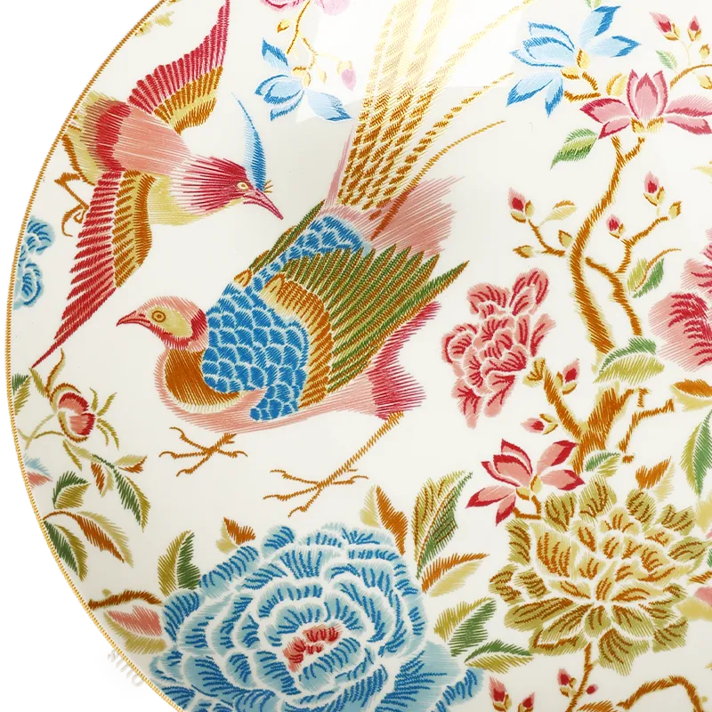 Left side floral and bird detail of 9’’ bone china salad plate.