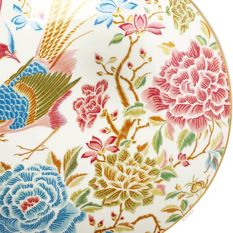 Right side floral and bird detail of 9’’ bone china salad plate.