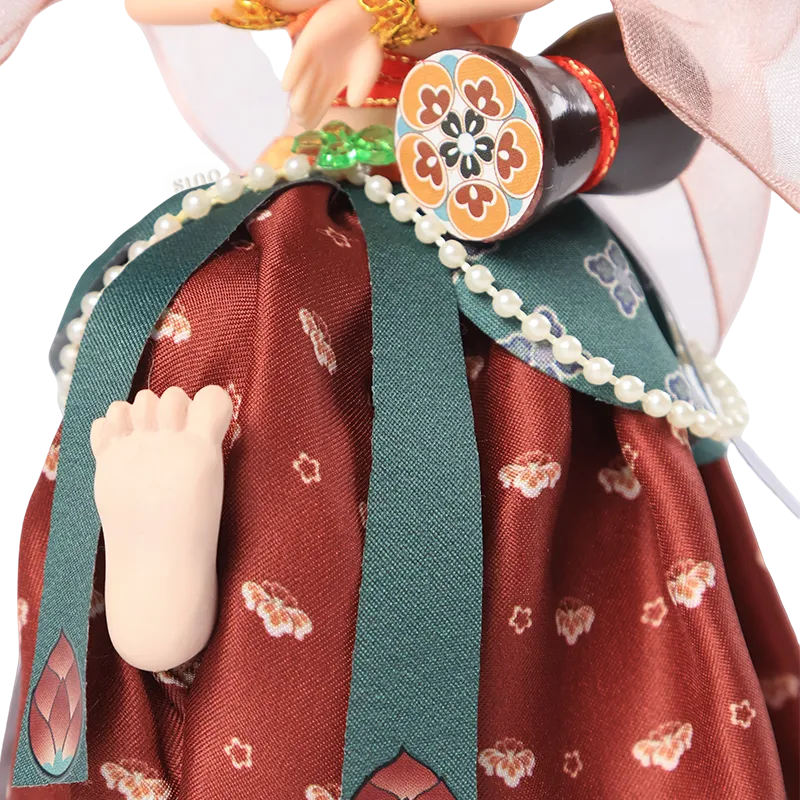 Lower body of 9-inch Dunhuang doll with bare foot and lifted pose.