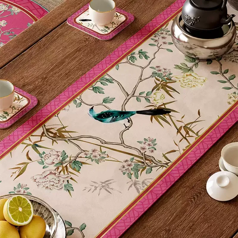 Intricate hand-painted cerulean birds and plum blossoms on luxe pink table runner.