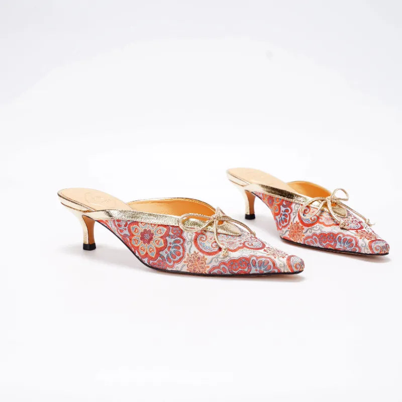 Luxury Song Brocade Auspicious Bloom mules displayed with pointed toe and kitten heel design.