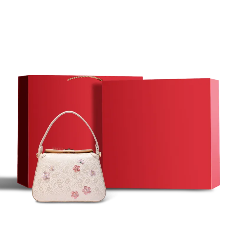 Red gift box packaging for plum blossom handbag.