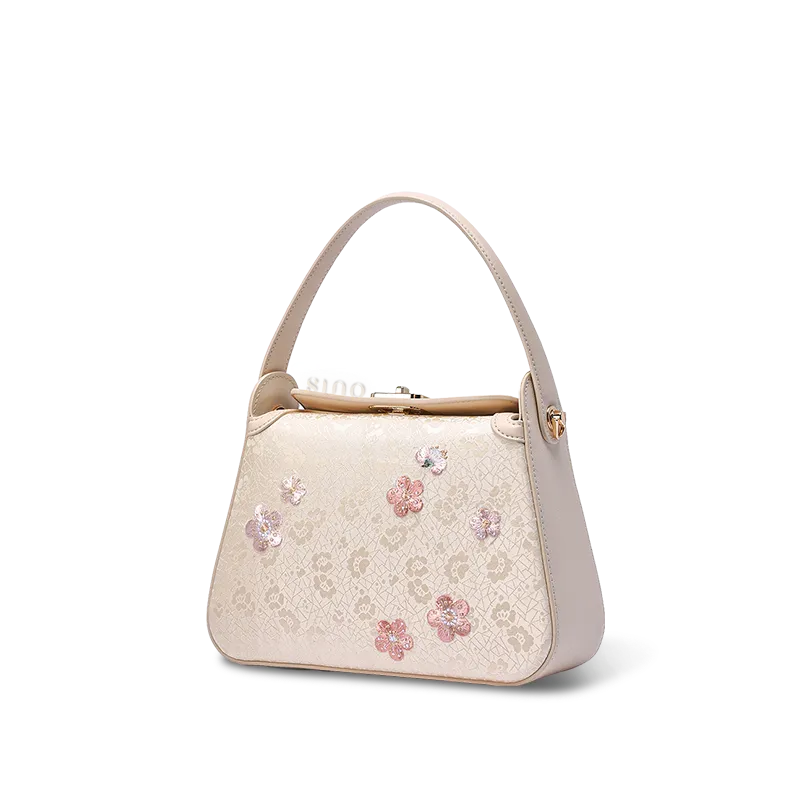 Side profile of luxury plum blossom silk handbag.