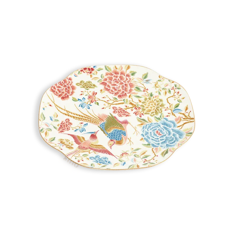 45° Angled view of floral and bird square dinner plate.