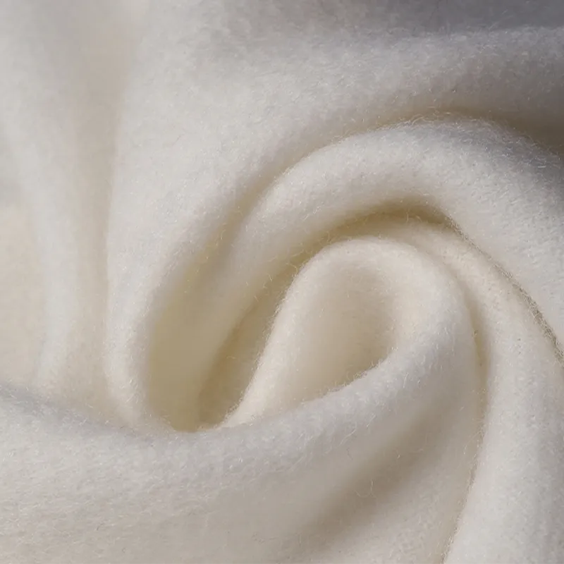 Ultra-soft drape of 100% cashmere scarf with camellia embroidery.