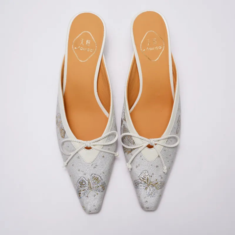 Top view of Chinese style Song Brocade kitten heel mules featuring butterfly patterns and refined pointed toe design.