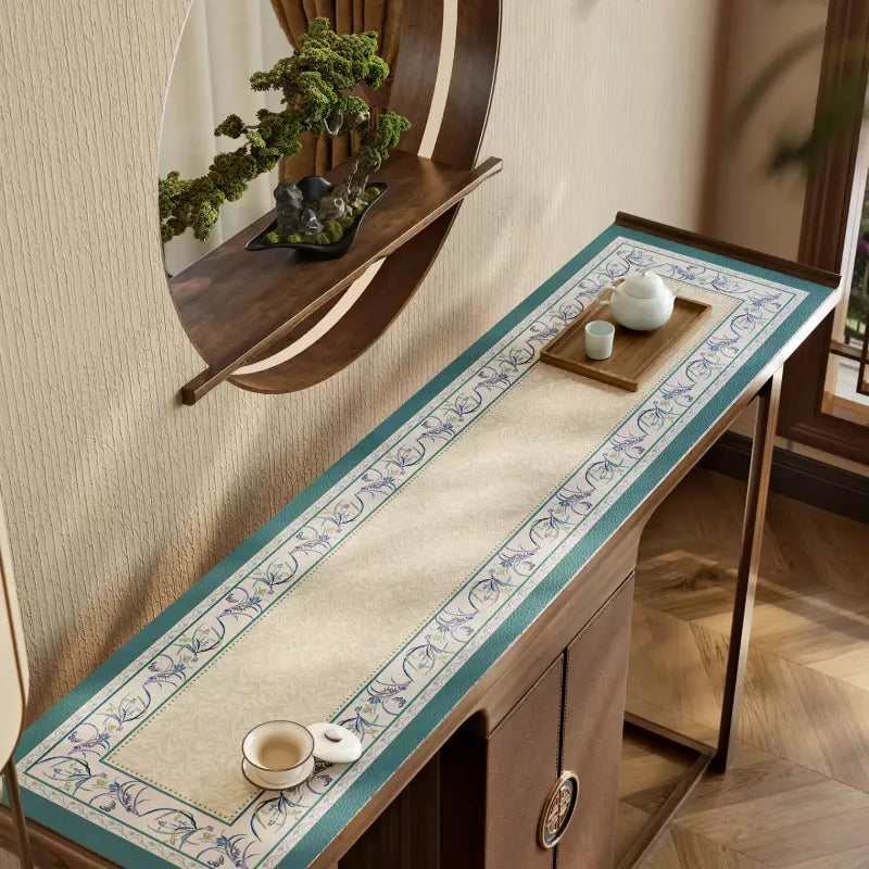 Chinoiserie blue cabinet top mat with floral border design.