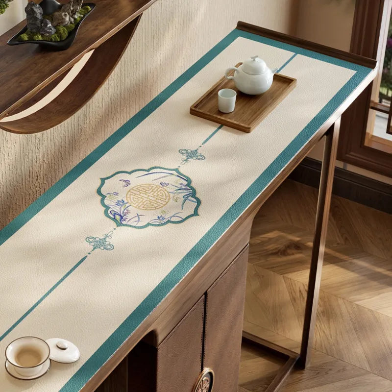 Chinoiserie blue leather protector mat for console table.
