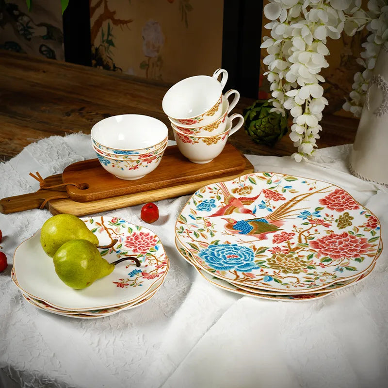 Angled top view of 12-piece Chinoiserie bone china square plate set with floral & bird design.