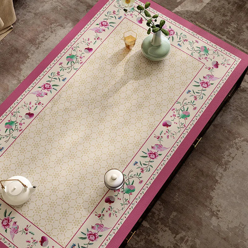 Chinoiserie coral pink coffee table mat with floral border top view.