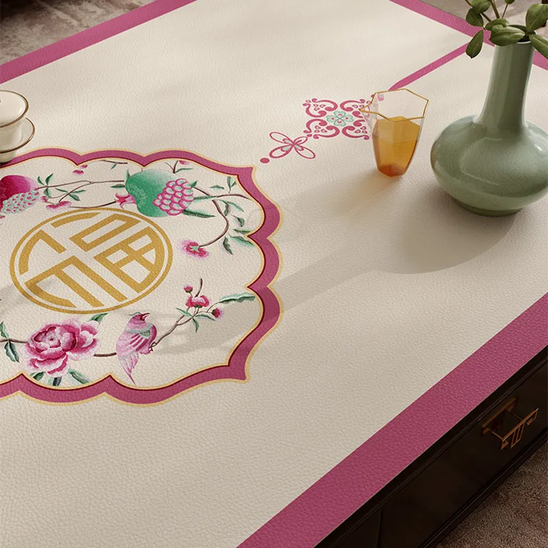 Chinoiserie coral pink coffee table mat with longevity motif detail.