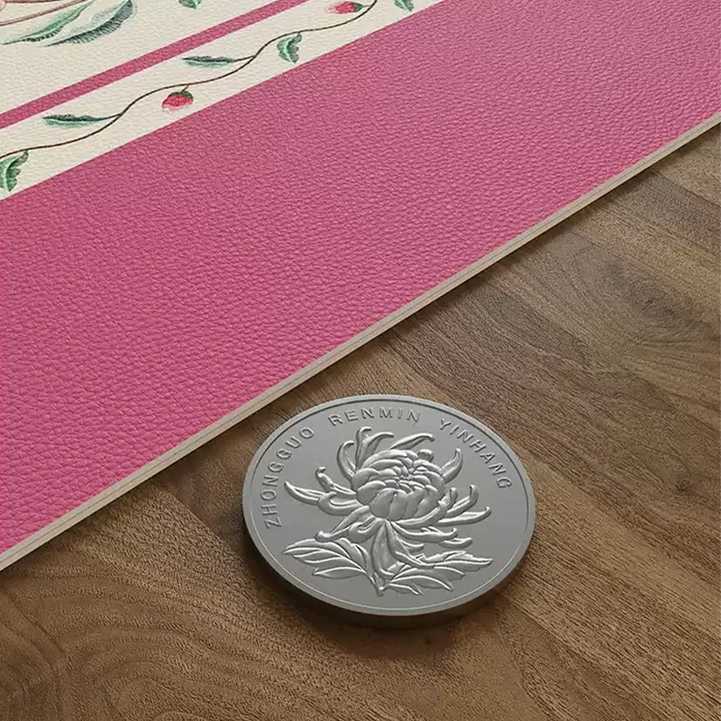 Chinoiserie coral pink leather table mat with thick edge detail.