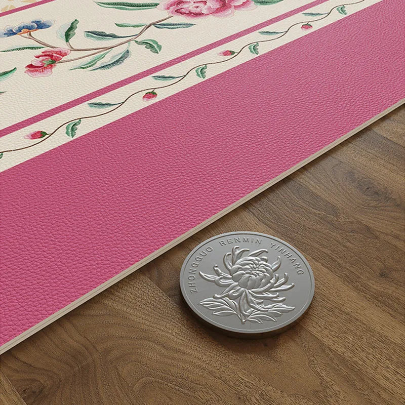 Chinoiserie coral pink round leather table mat edge detail.