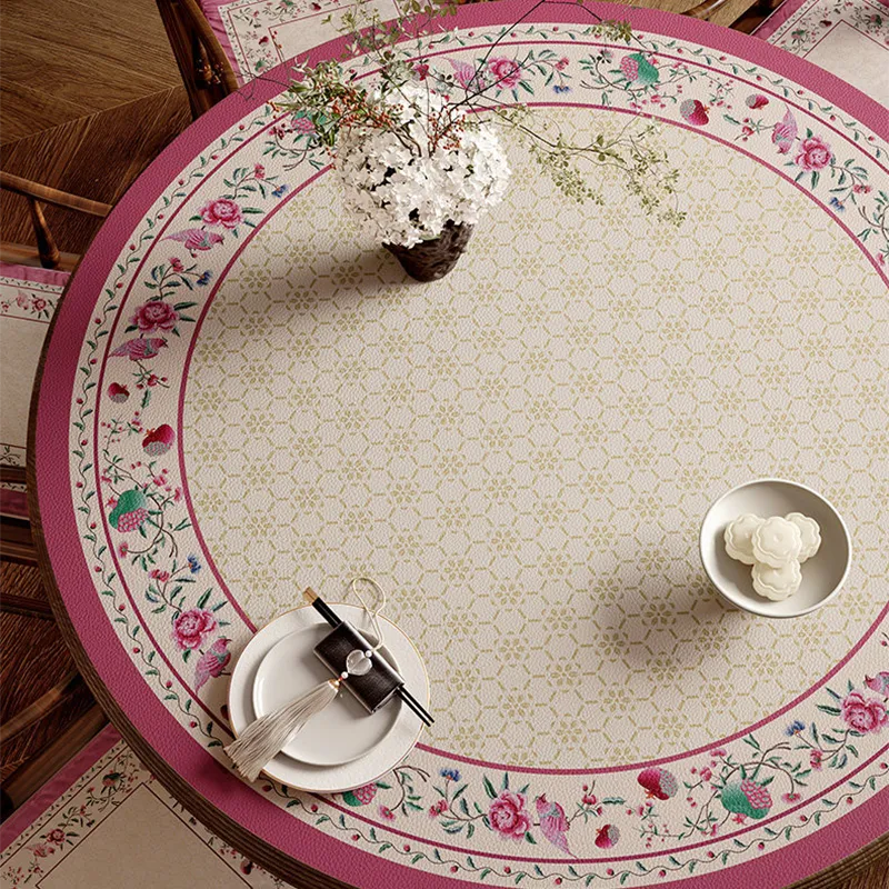 Chinoiserie coral pink round table mat with floral border top view.