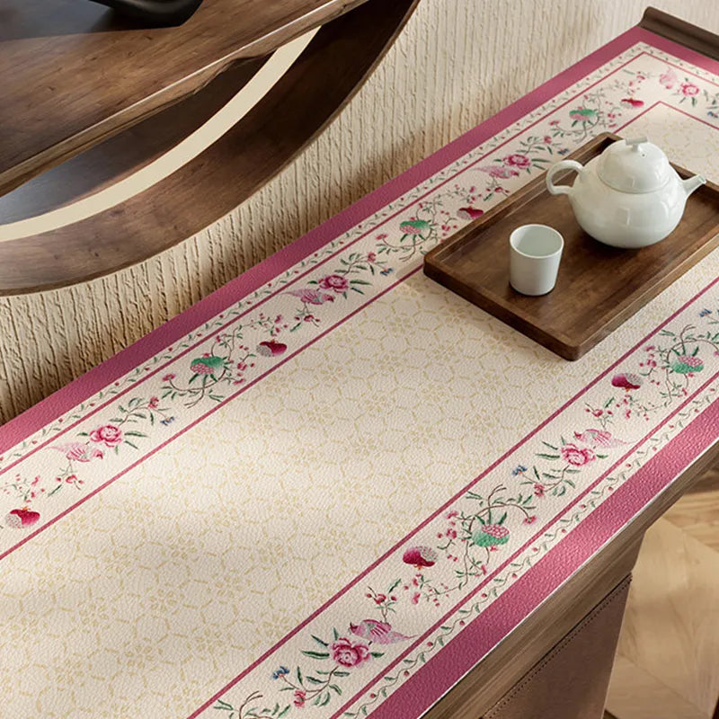 Chinoiserie coral pink sideboard table mat with floral border.