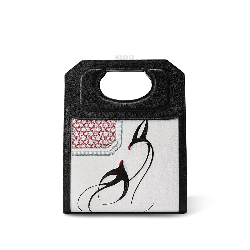 Luxury Chinoiserie embroidered leather handbag featuring spring swallows motif.