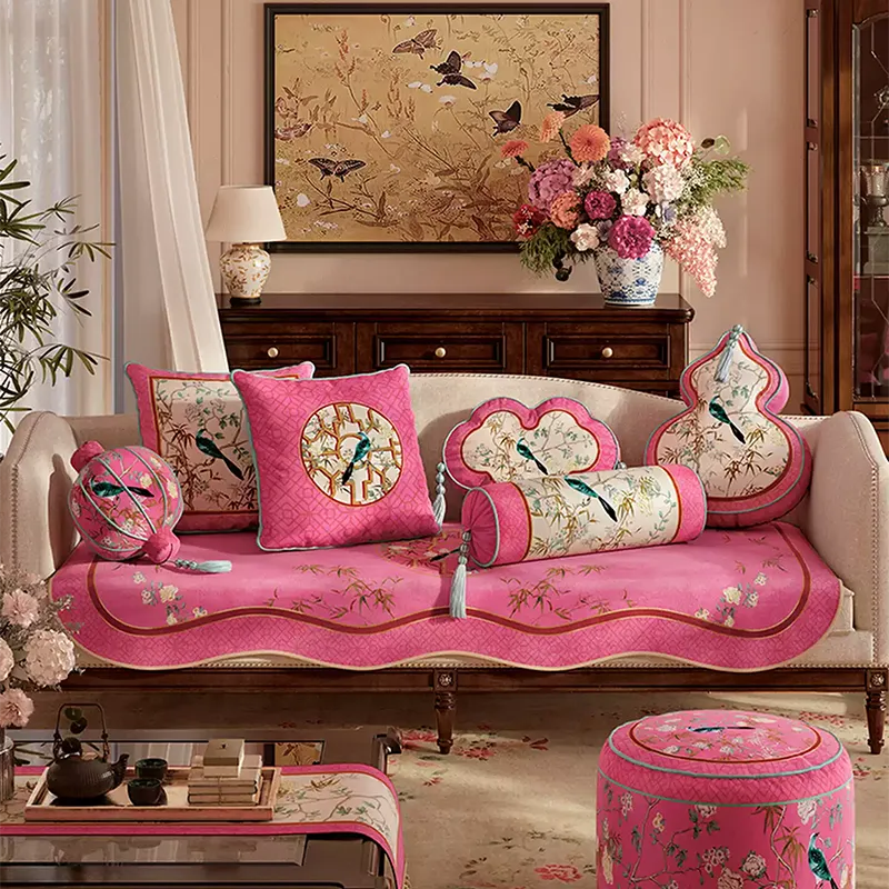 Gourd, ruyi, armrest and lantern chinoiserie window lattice pillows on sofa.