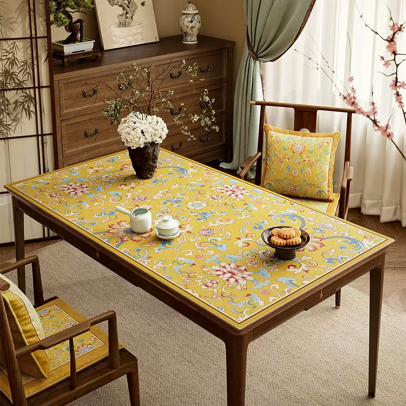 Diagonal view: imperial yellow enamel floral leather table mat.