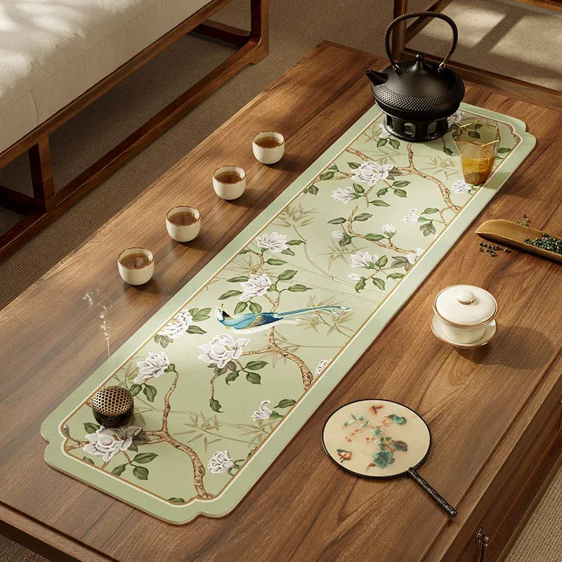 Style A tea mat chinoiserie jade green leather placemat on tea tray with teacup.