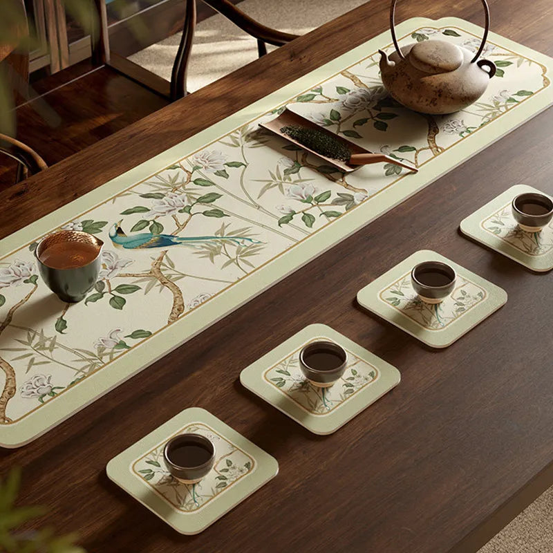 Style B tea mat chinoiserie jade green leather placemat on tea tray with teacup.