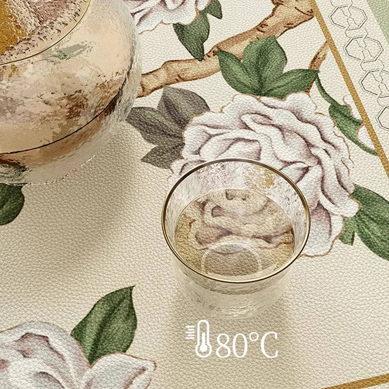 Heat-resistant jade green leather round table mat holding a cup of 80°C hot water.