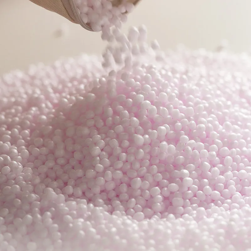 Detail view of abundant eco-friendly foam bead filling inside the couch cushion pouf for a soft, supportive feel.