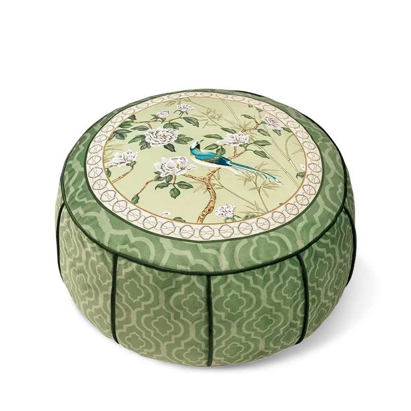 Chinoiserie jade green living room rest floor pouf with a floral and bird pattern shown on a white background.