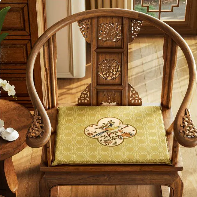 Autumn Splendor Chinoiserie dining chair cushion with golden medallion bird design on a traditional wooden chair for elegant fall home decor.