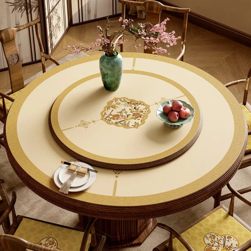 Autumn Splendor round leather table mat with ivory Chinoiserie medallion design and matching rotating table centerpiece.
