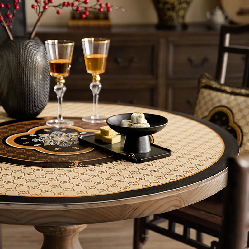 Beige round table mat with Chinoiserie bamboo and Ruyi pattern.