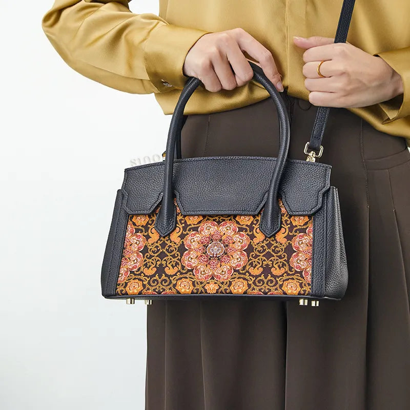 Model wearing crossbody bag at hip with both hands holding straps, luxury Chinoiserie style.