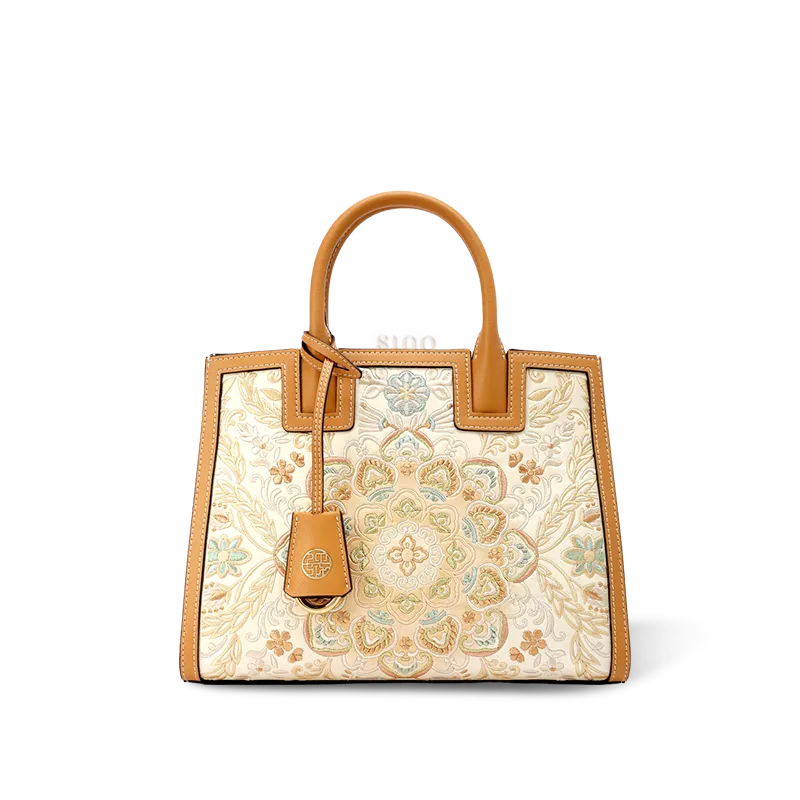 Chinoiserie luxury leather handbag with embroidered Baoxiang motif main view.