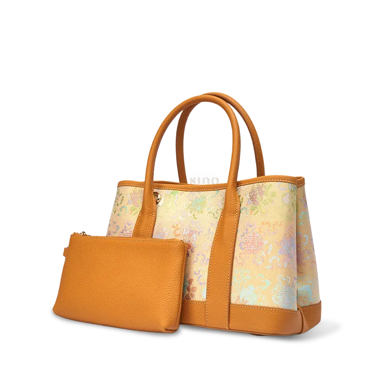 Side view of luxury gold-woven Song brocade double happiness floral tote bag with inner pouch on white background.