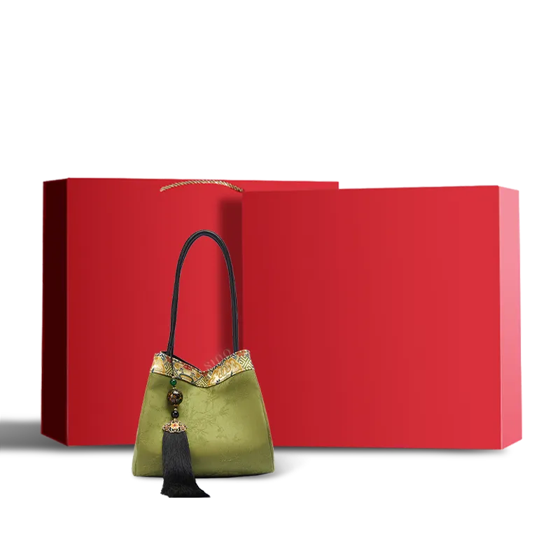 Light green Xiangyunsha silk jacquard bucket handbag presented in a red gift box.