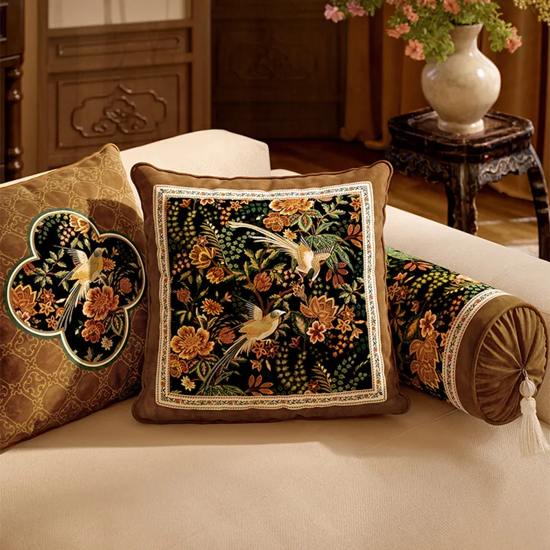 Style A, B and armrest chinoiserie pillows on sofa, close angled view.