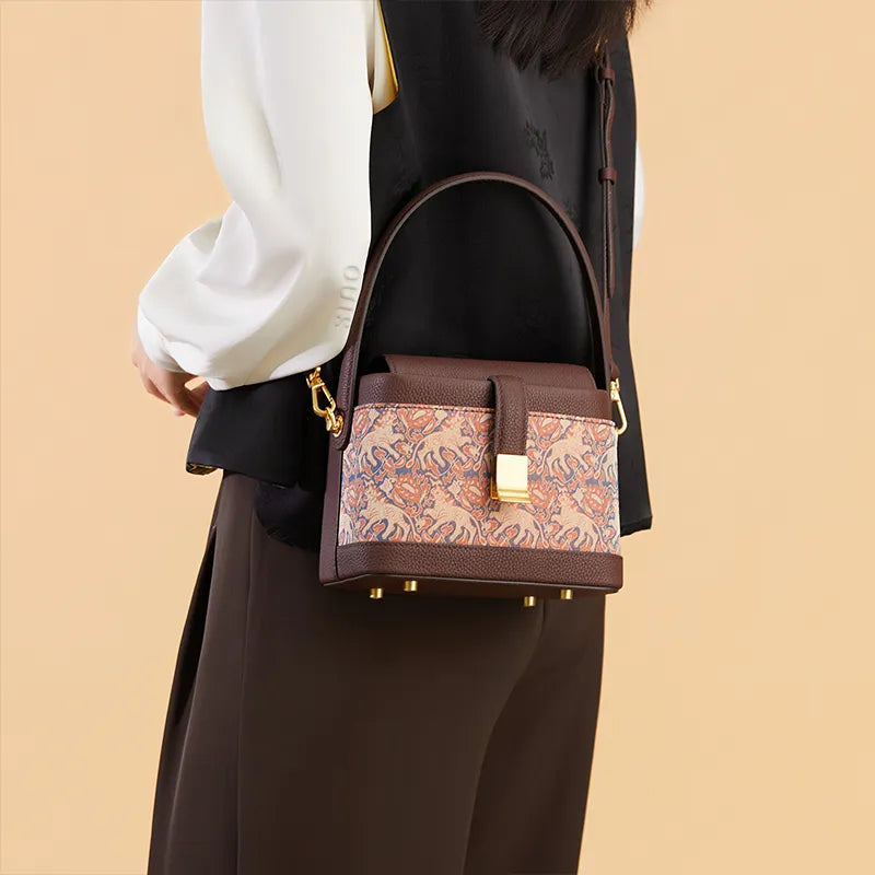 Model left-profile wearing crossbody bag at waist, front view.