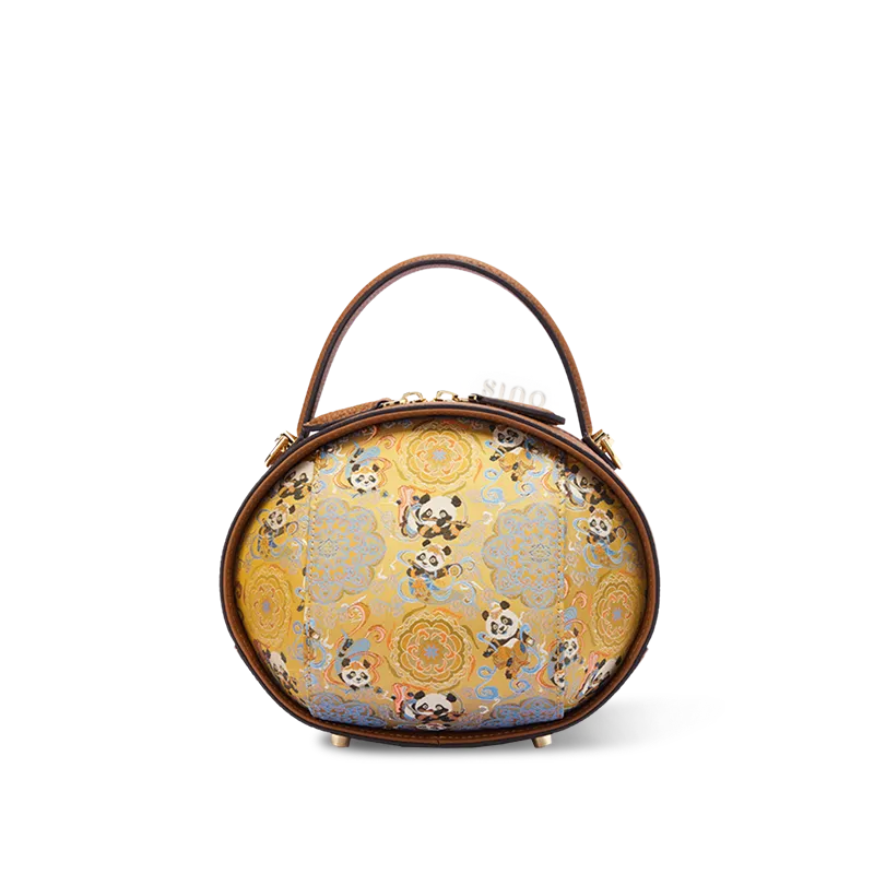 Front view of brown Song Brocade handbag with Panda Pattern on white background.