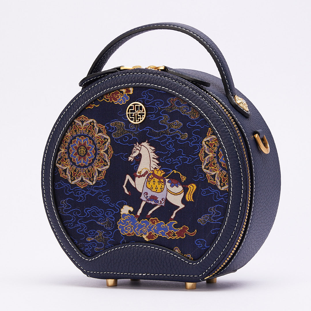 Side view of Chinoiserie luxury Song brocade round bag with horse-year blessings motif on white background.